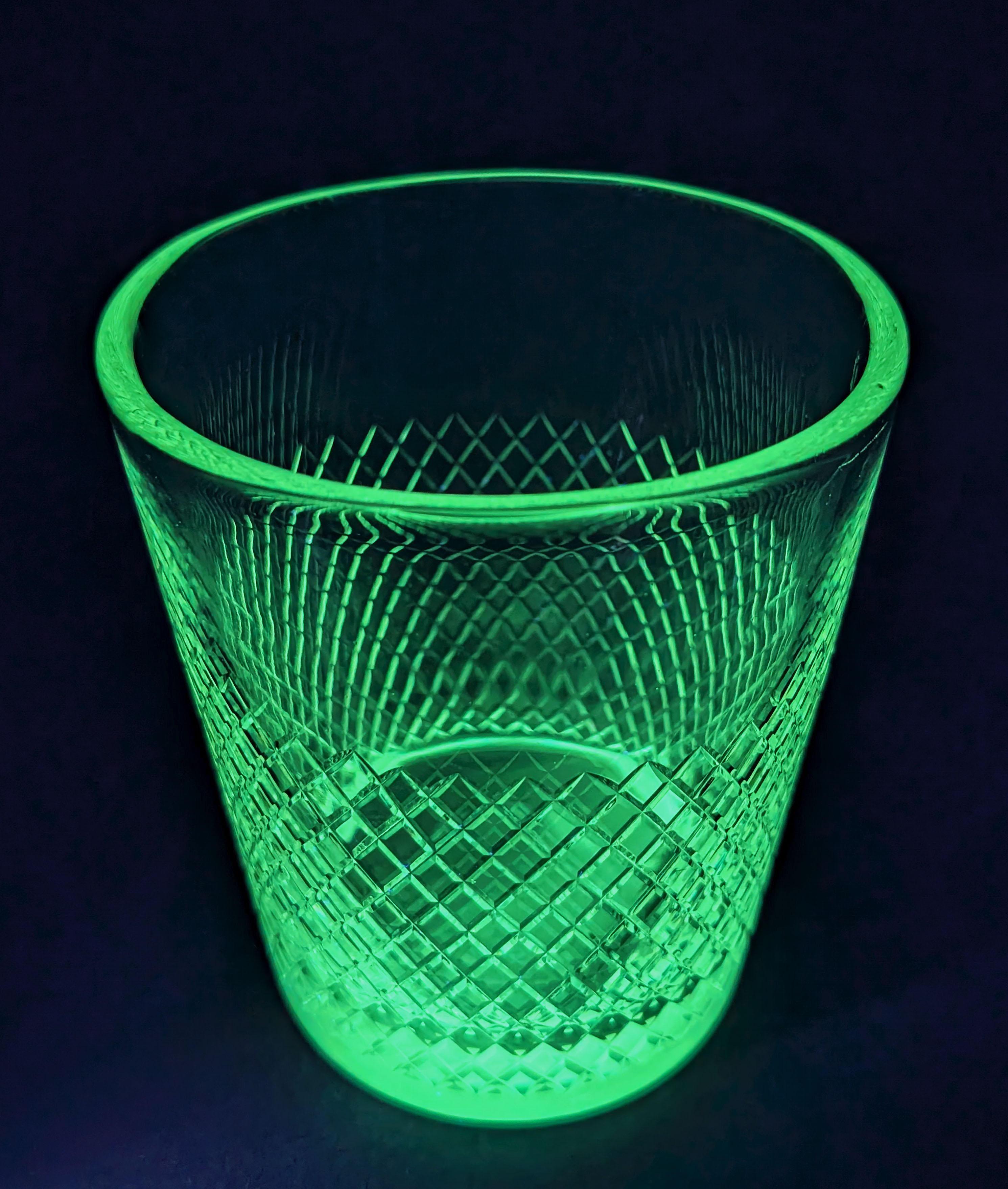 Vintage crystal ice bucket with gold tongs.