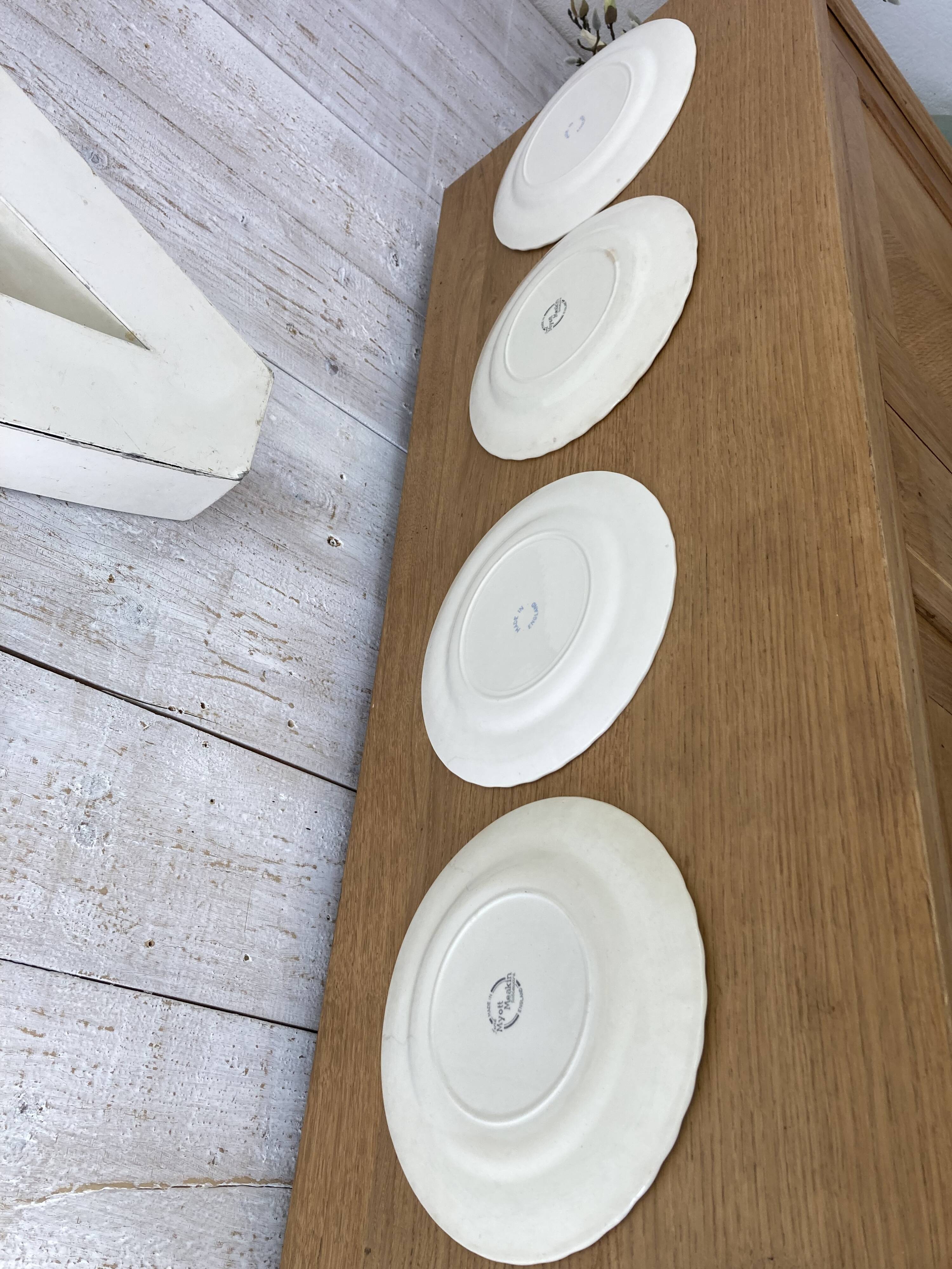 Four old blue plates