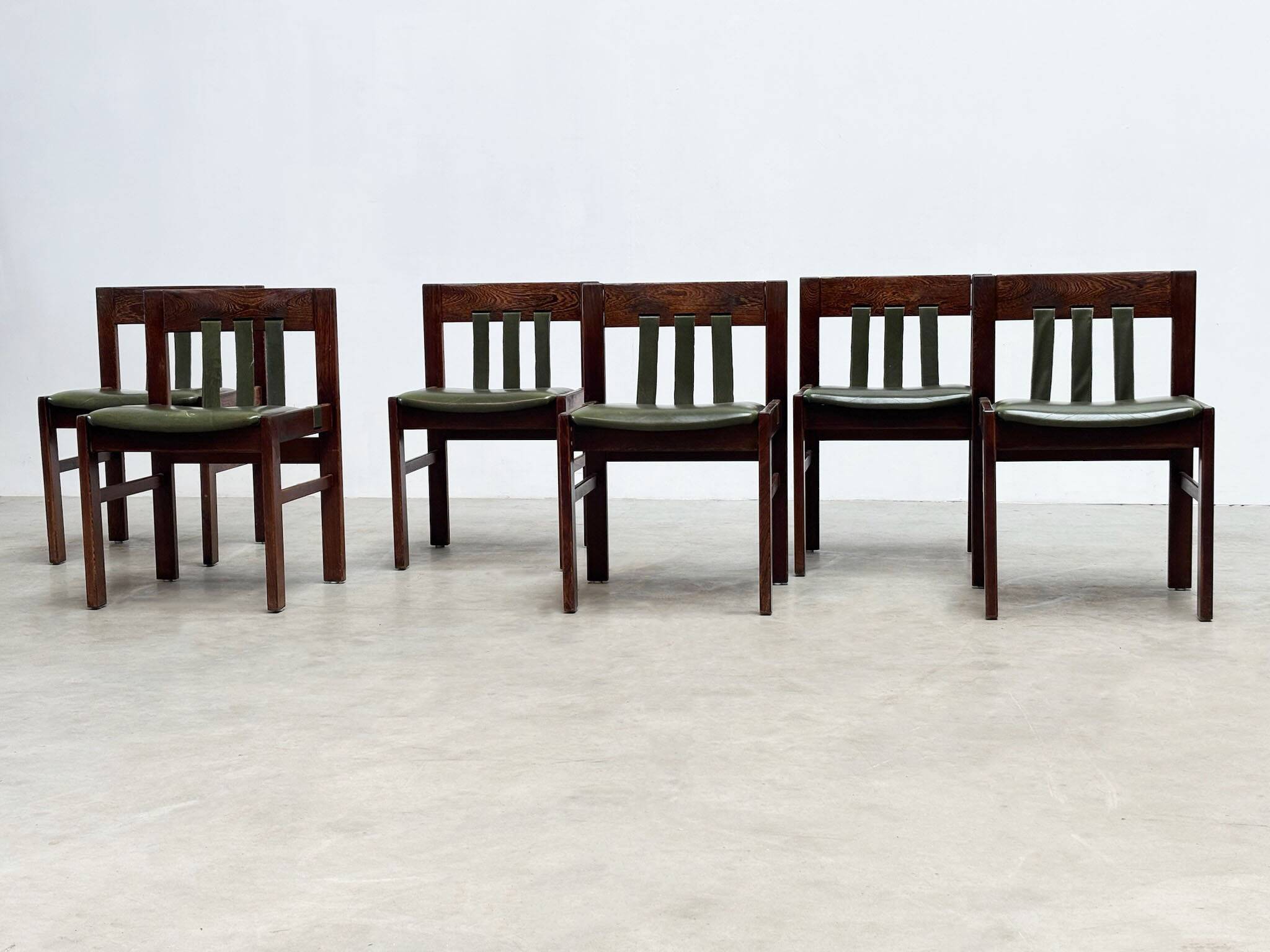 Green leather brutalist dining chairs