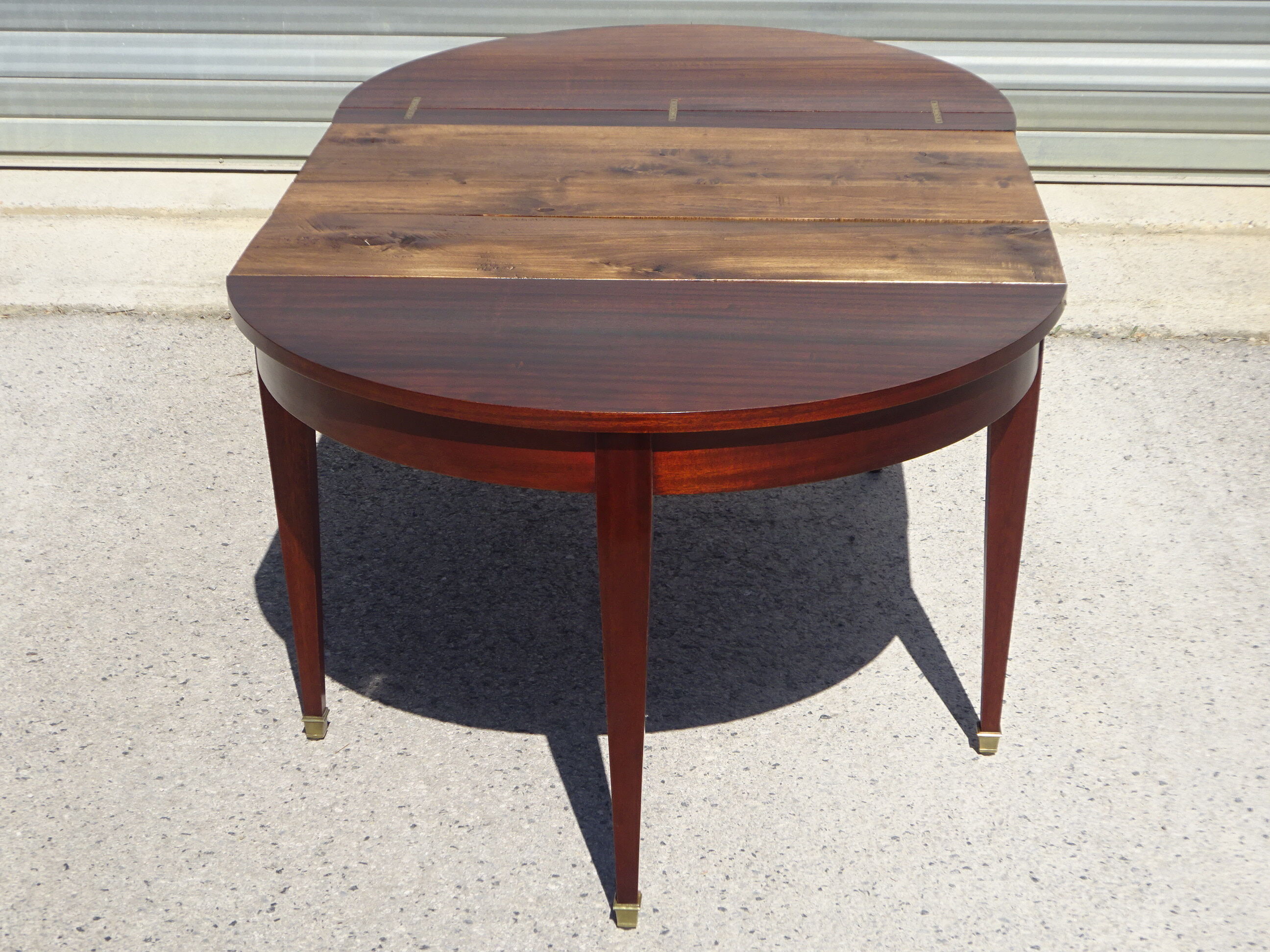 Half-moon console table, extendable in Empire style.