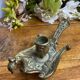 Hand candlestick, peacock shape, in bronze