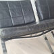Pair of black leather loung chairs by Hans Eichenberger for Girsberger
