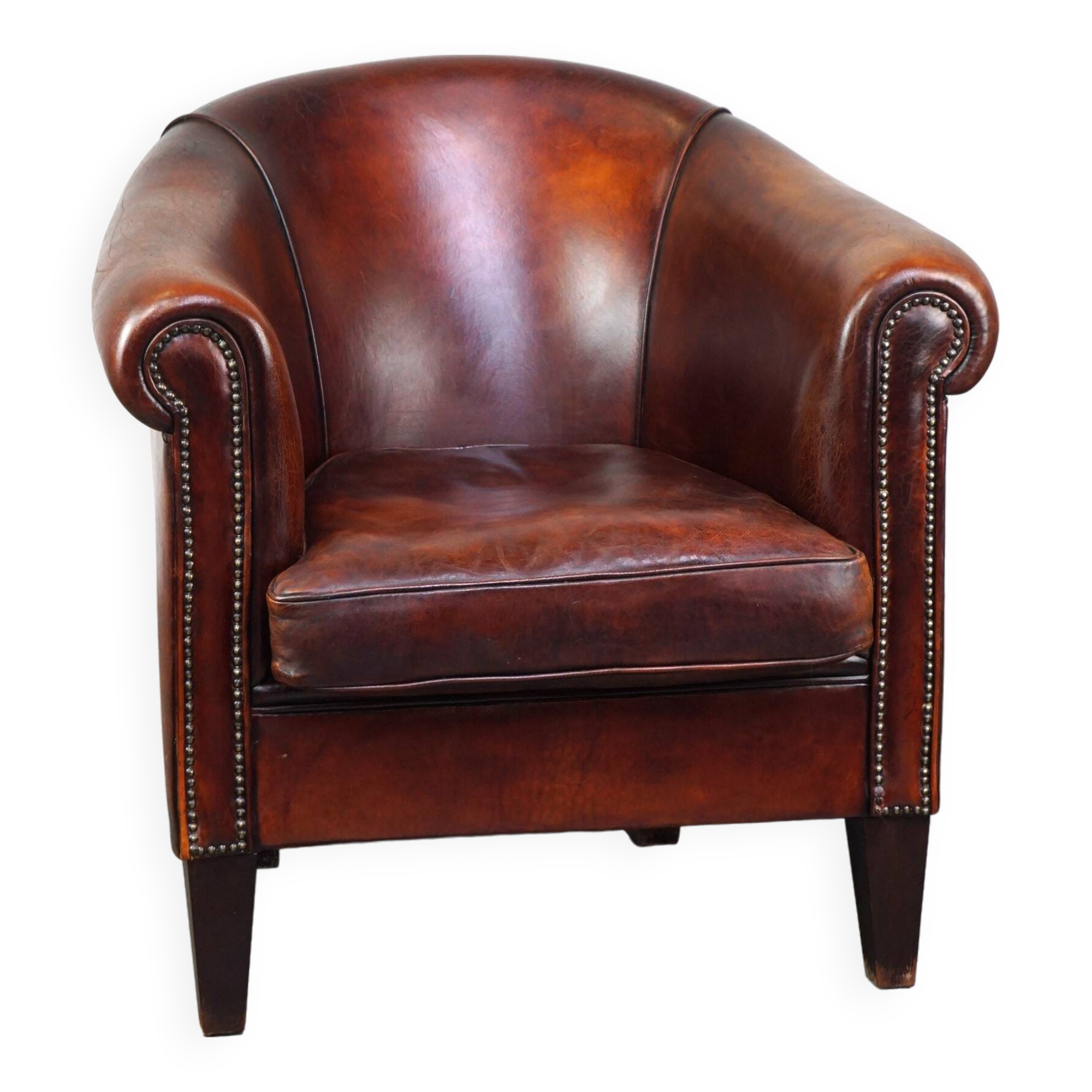 Very luxurious dark brown sheepskin club chair with a more than beautiful patina