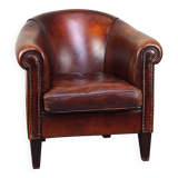 Very luxurious dark brown sheepskin club chair with a more than beautiful patina
