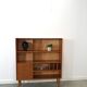 Deens teak vakkenkast met lades en hoge poten, vintage wandkast