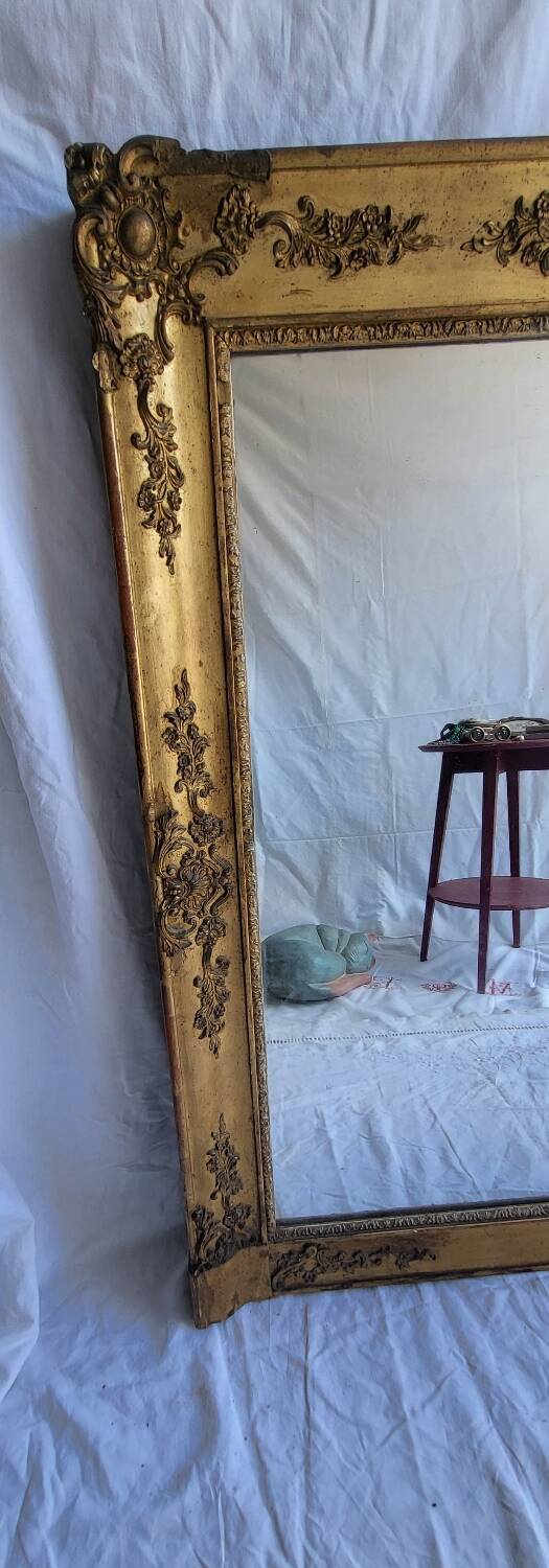 Antique Louis Philippe style gilded mirror decorated with floral motifs