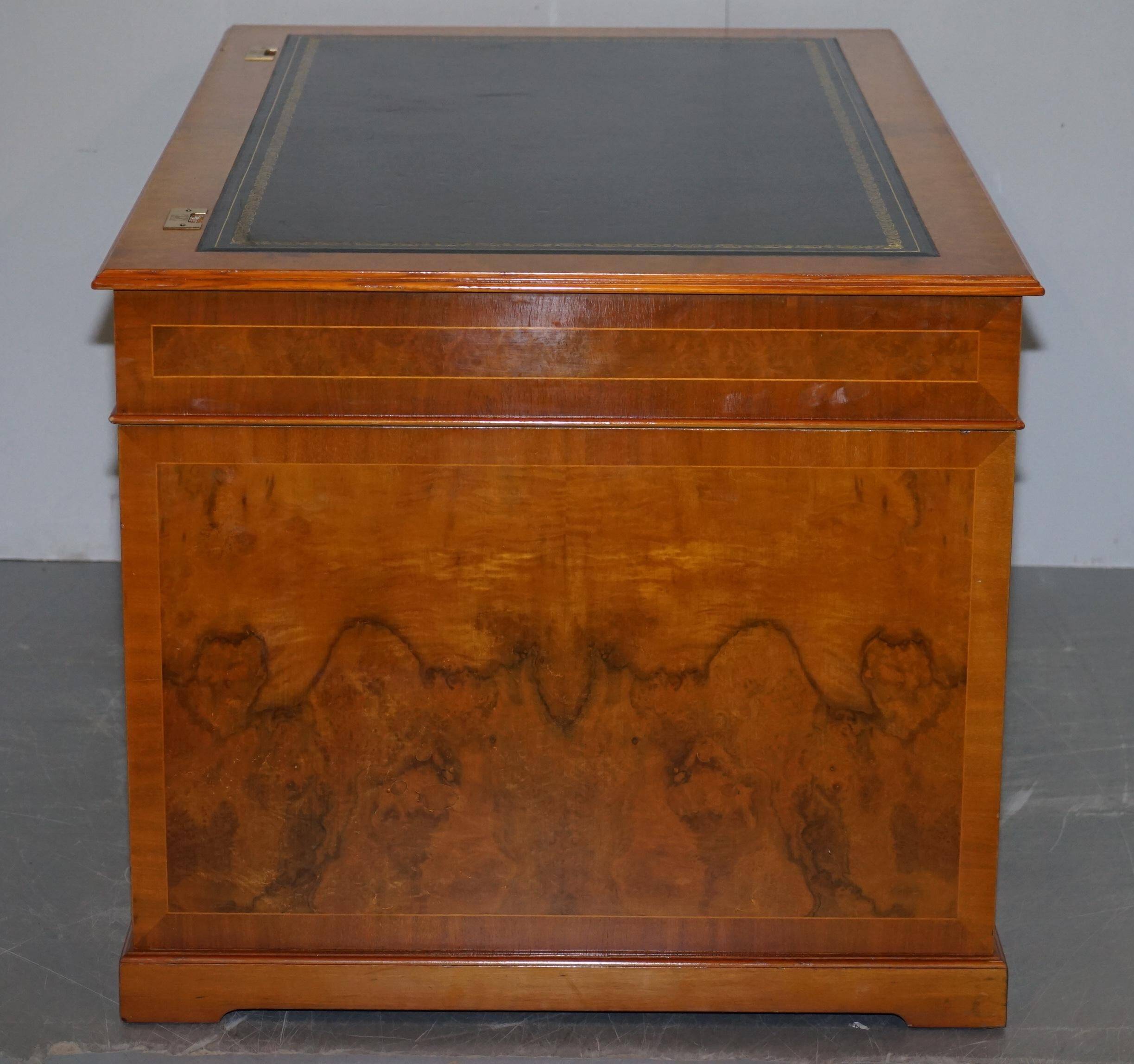 Partner desk in burr walnut designed to conceal computer equipment.