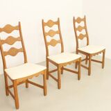 Four oak dining chairs by Henning Kjaernulf.