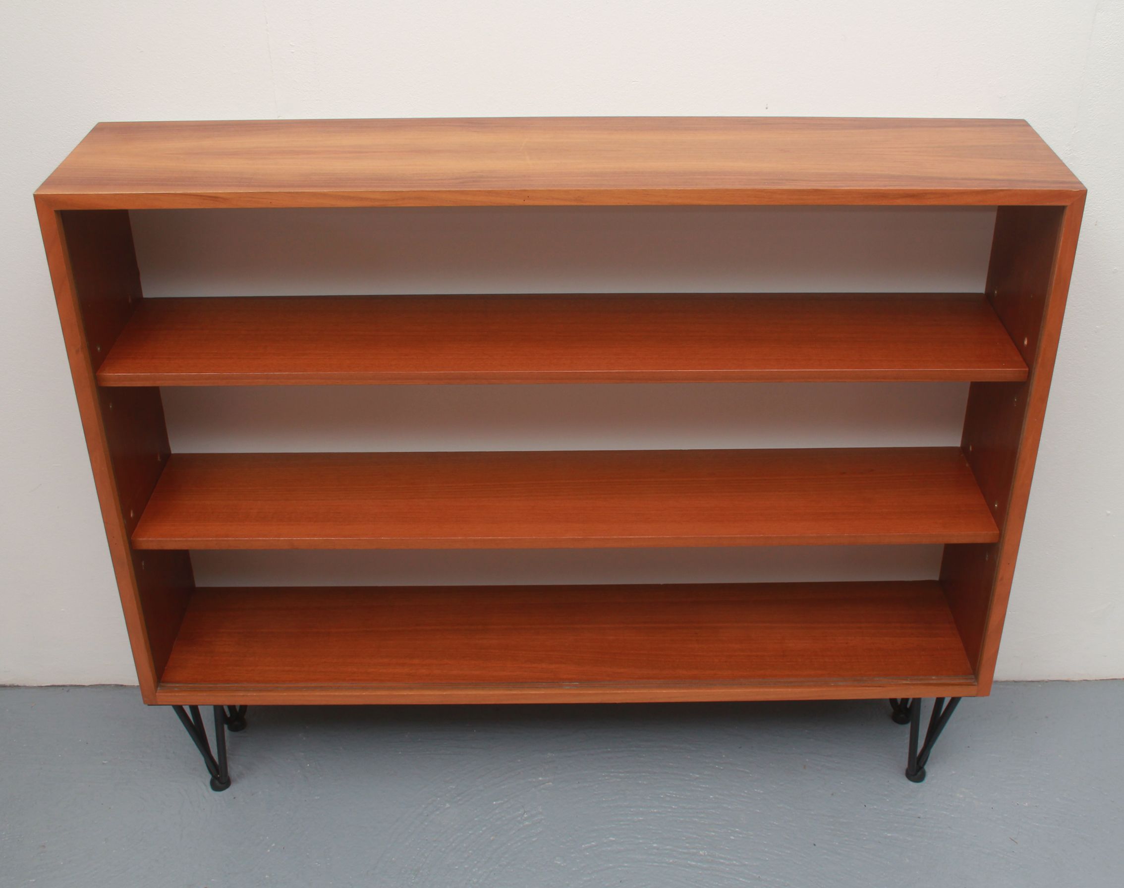 1960s book shelf in walnut, white back panel