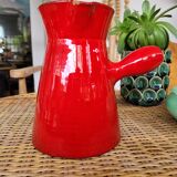 Ancient pitcher in red enamelled sandstone