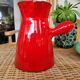 Ancient pitcher in red enamelled sandstone