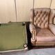 Pair of Chesterfield leather wingback armchairs