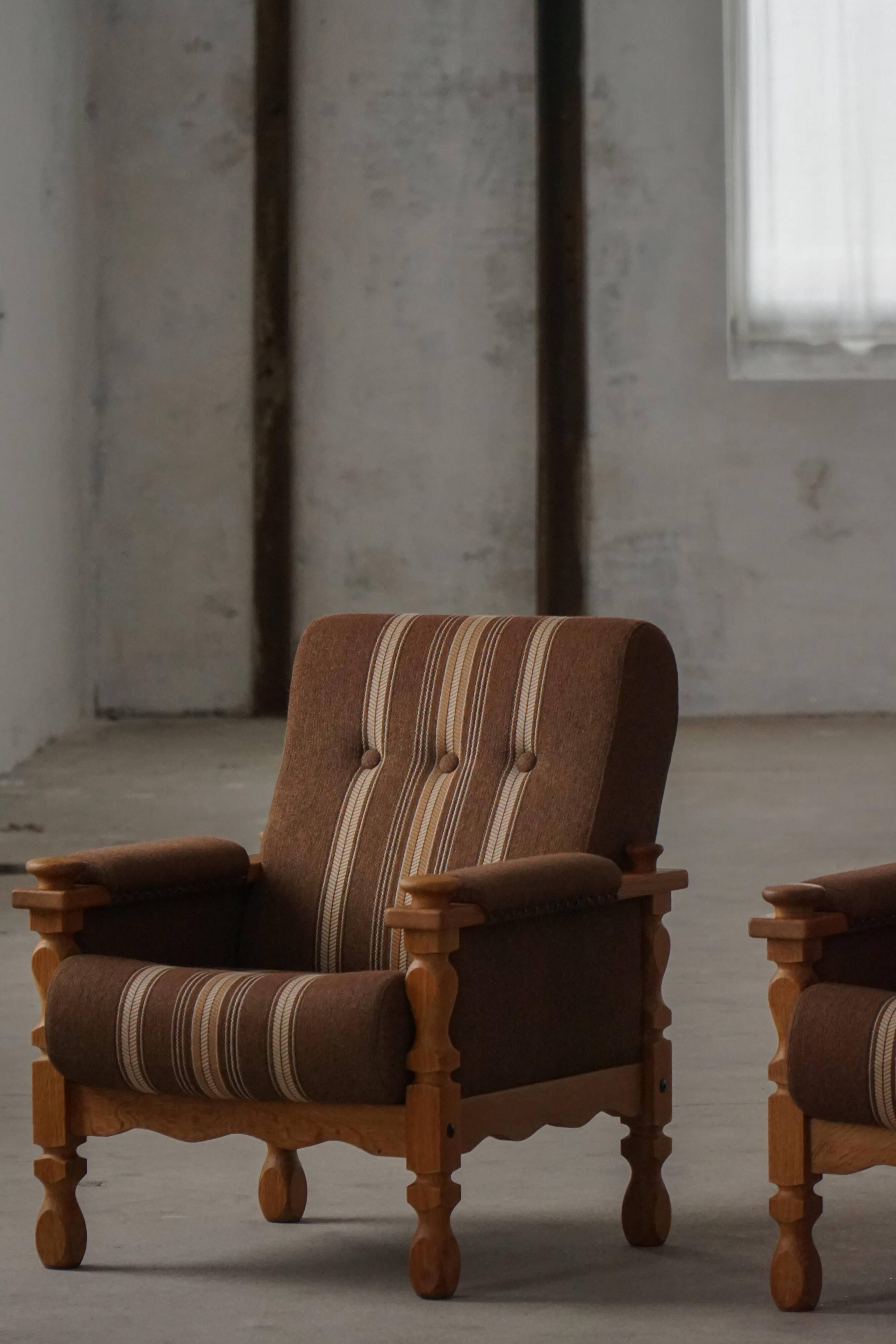 Modern Danish, a pair of lounge chairs in oak and wool, Henning Kjærnulf, 1960s.