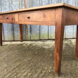 Antique solid cherry farmhouse table with 2 front drawers.
