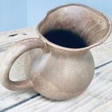 Pitcher in old sandstone