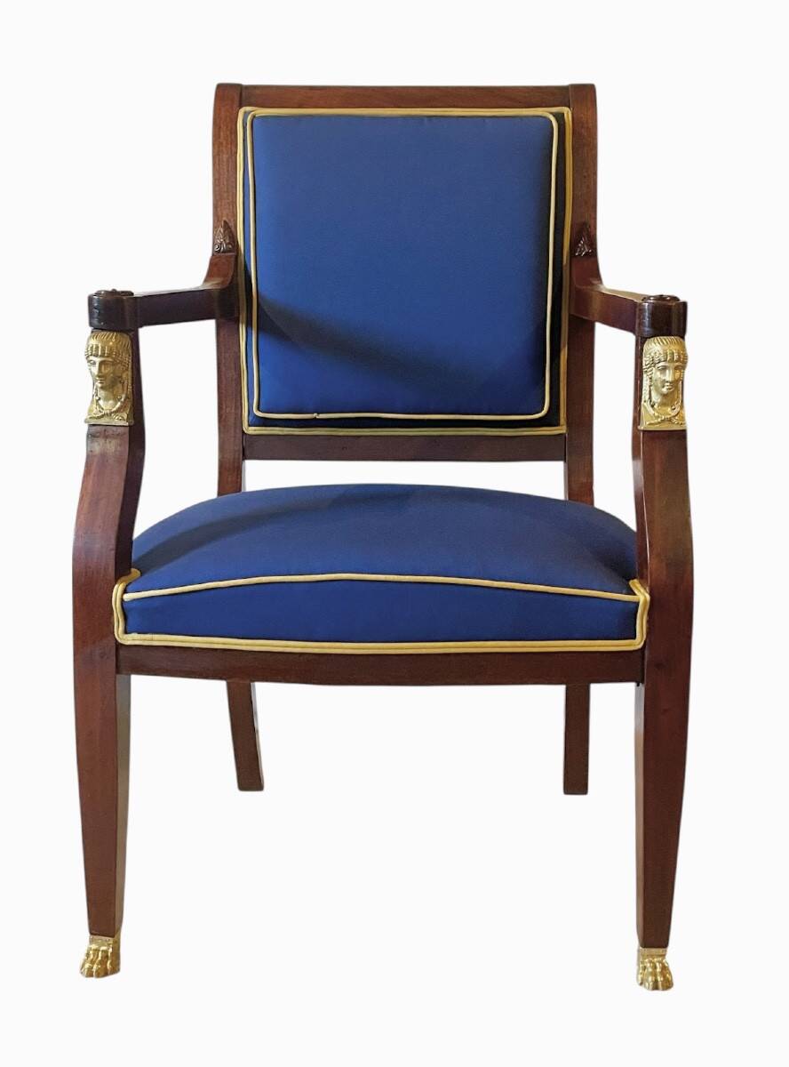 Pair of Empire style armchairs in mahogany and gilt bronze.