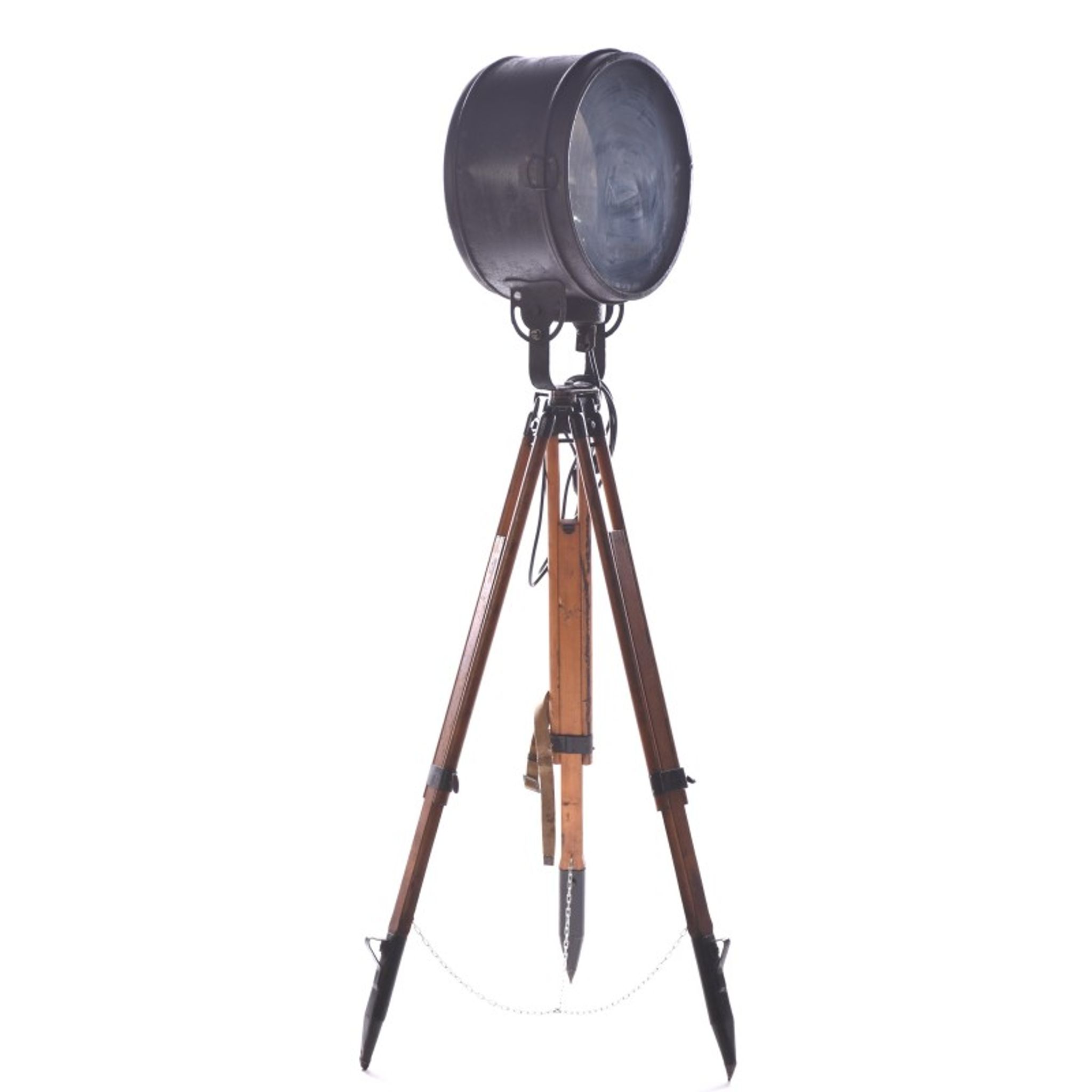 Old industrial spot on wooden tripod