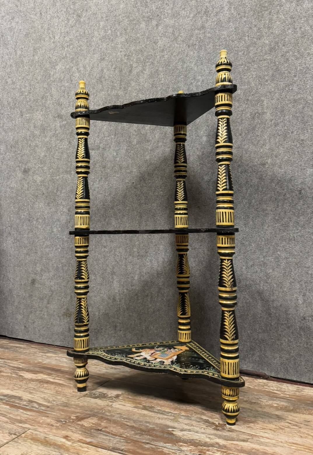 India circa 1900: attractive corner shelf in lacquered and painted wood