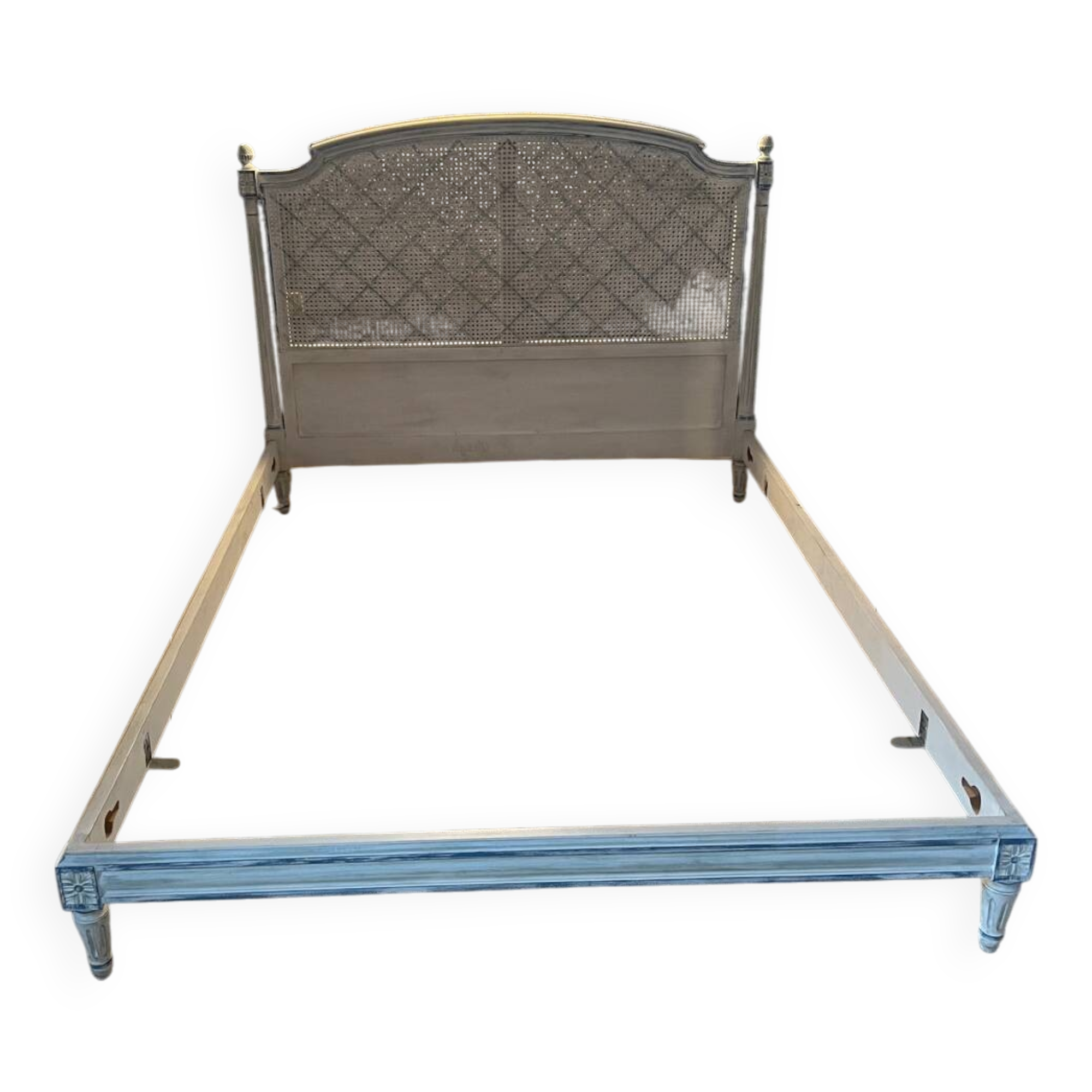 White wooden cane bed