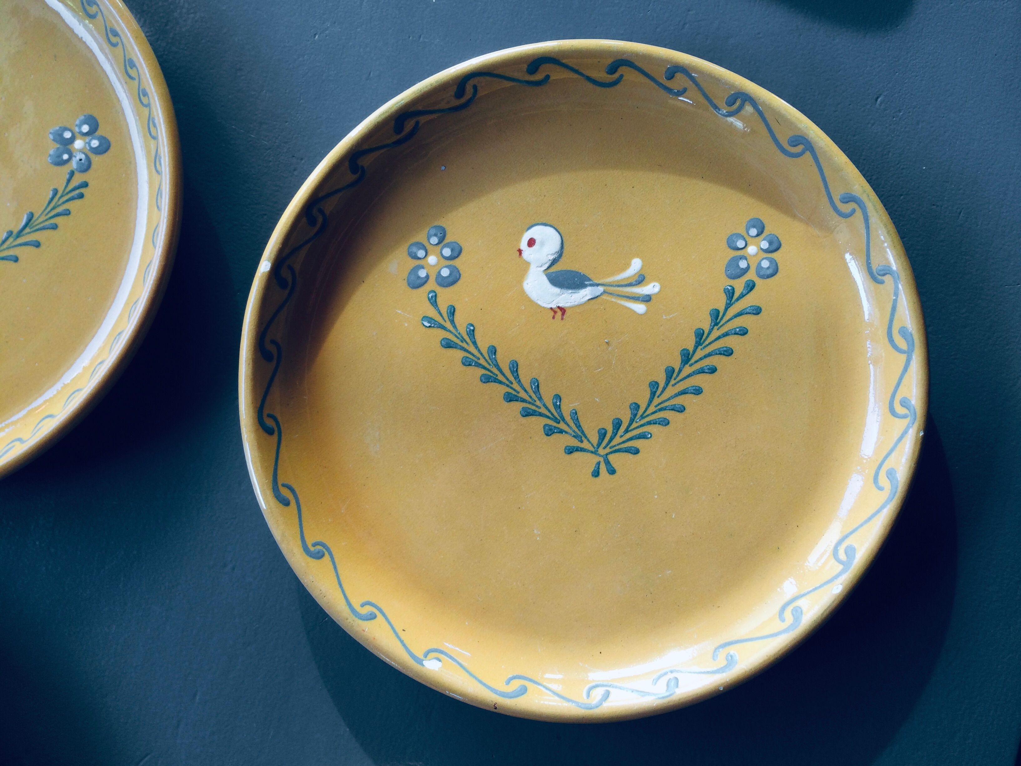 The six Piaf plates in painted terracotta