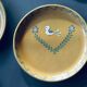 The six Piaf plates in painted terracotta