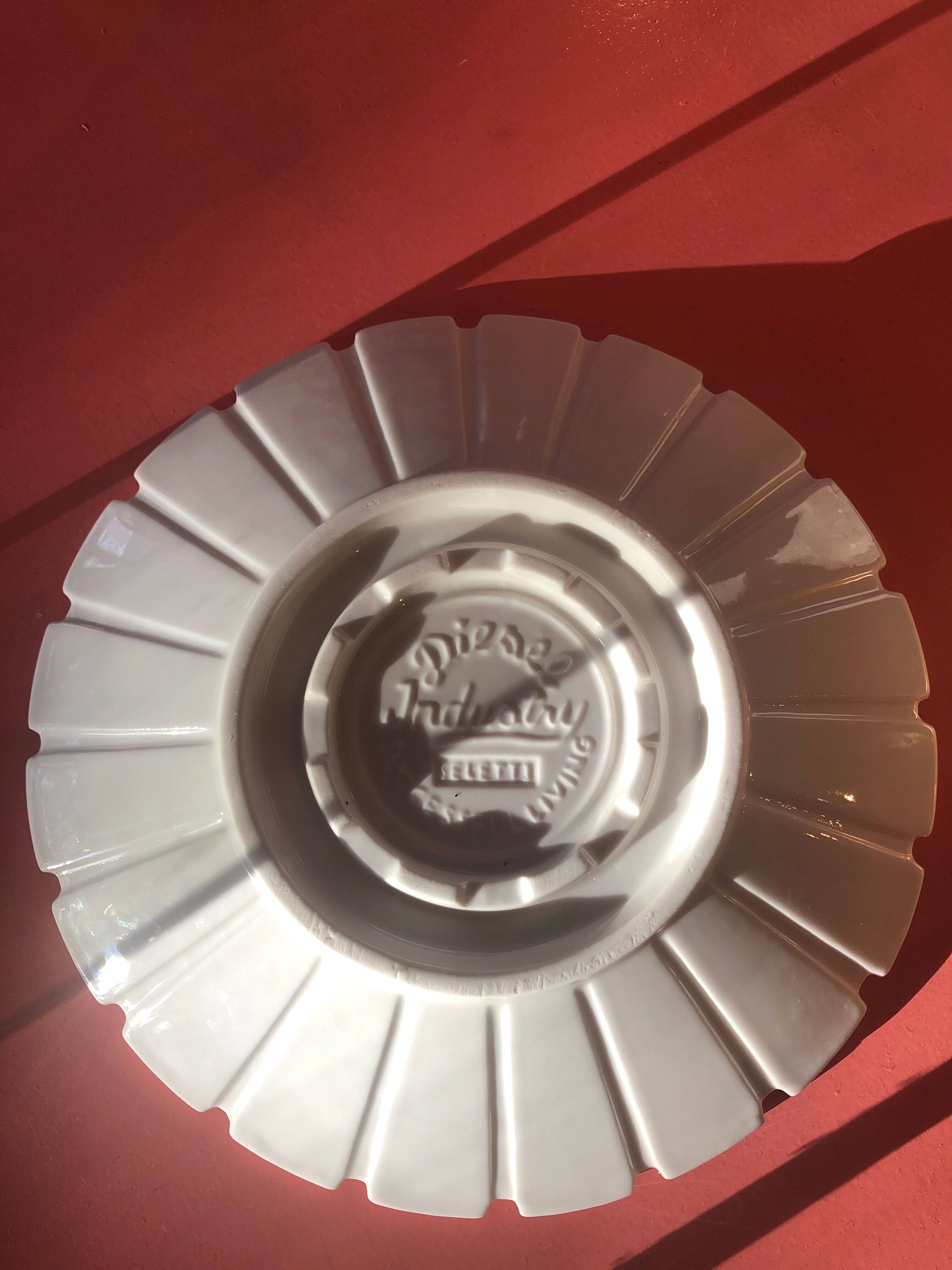 6 white Seletti/Diesel plates