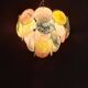 Handcrafted chandelier with Murano glass discs.