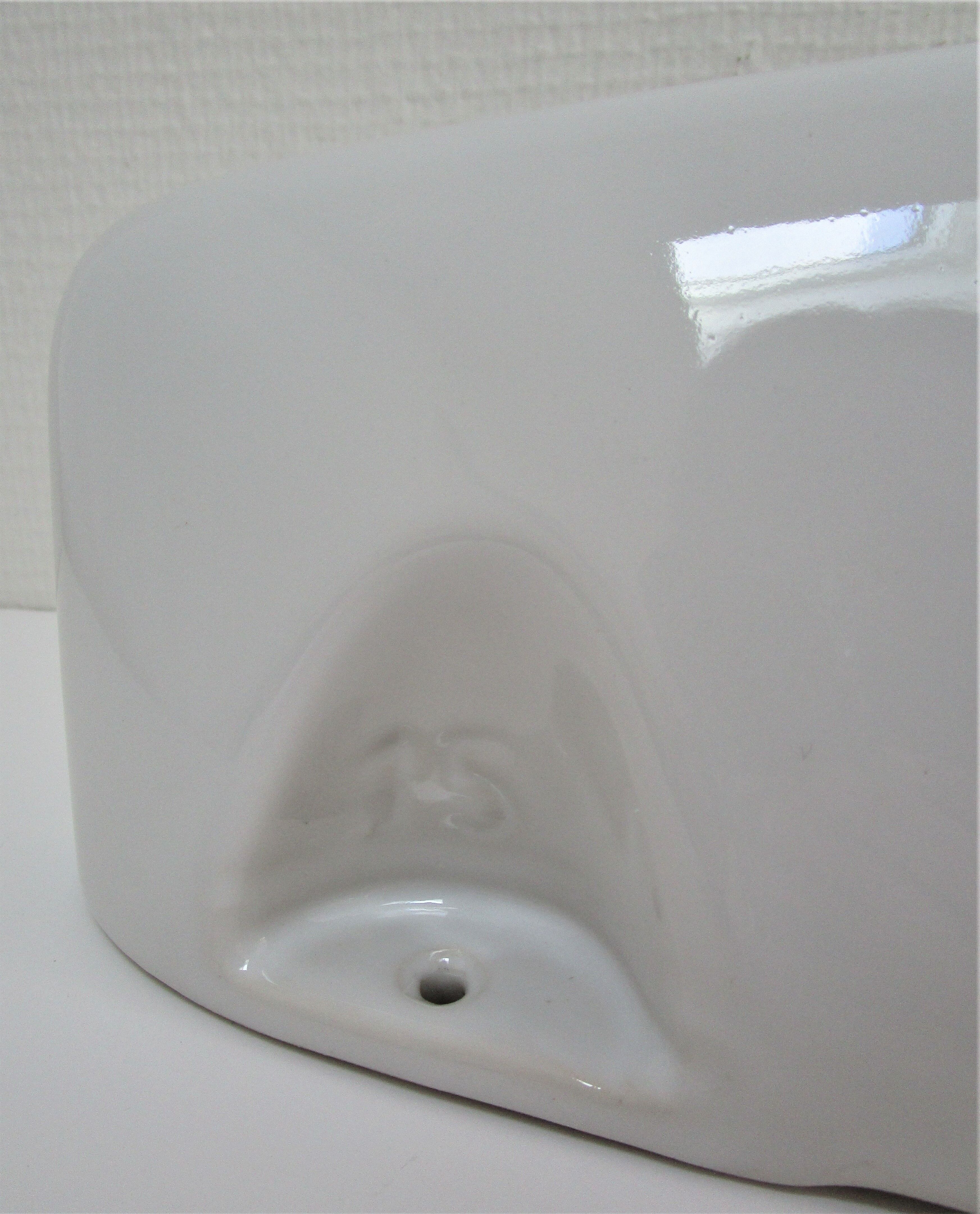 Vintage white enamelled ceramic wall shelf