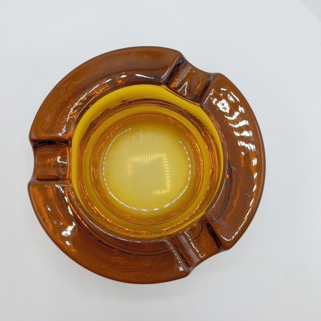 Amber glass ashtray 70s