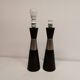 Two table lamps made of dark-stained wood with silver detail in the middle.