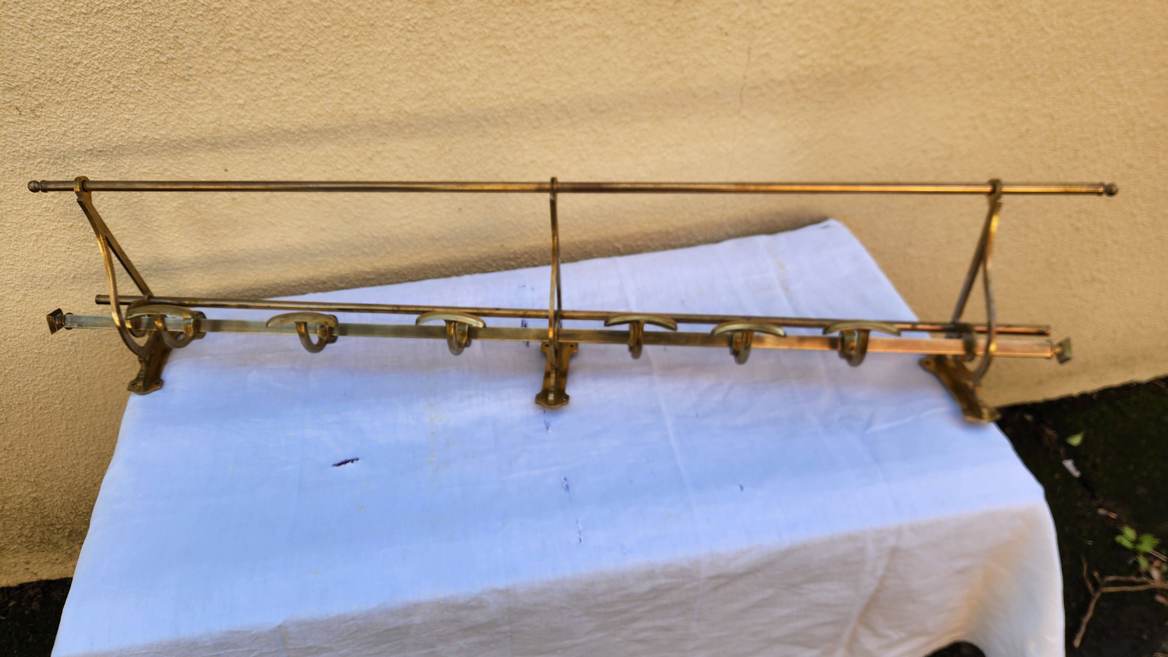 very beautiful wall-mounted coat rack wardrobe in brass from the 19th century
