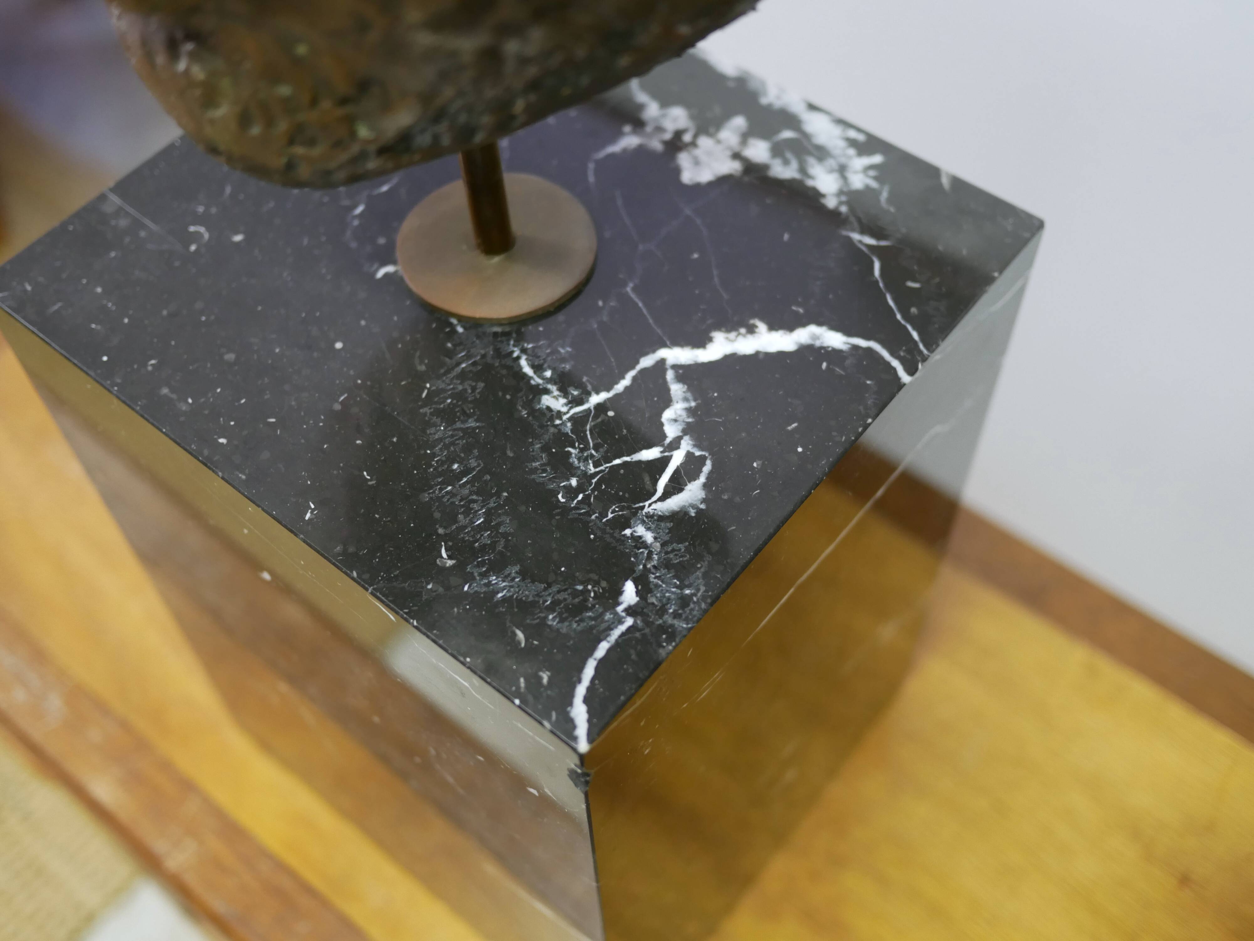 Buddha head sculpture, marble base