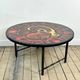 Vintage round coffee table in graphic red and yellow ceramic from the 1960s.