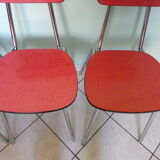 Table in red formica, 4 roc chairs, 2 extension cords, 2 drawers 60