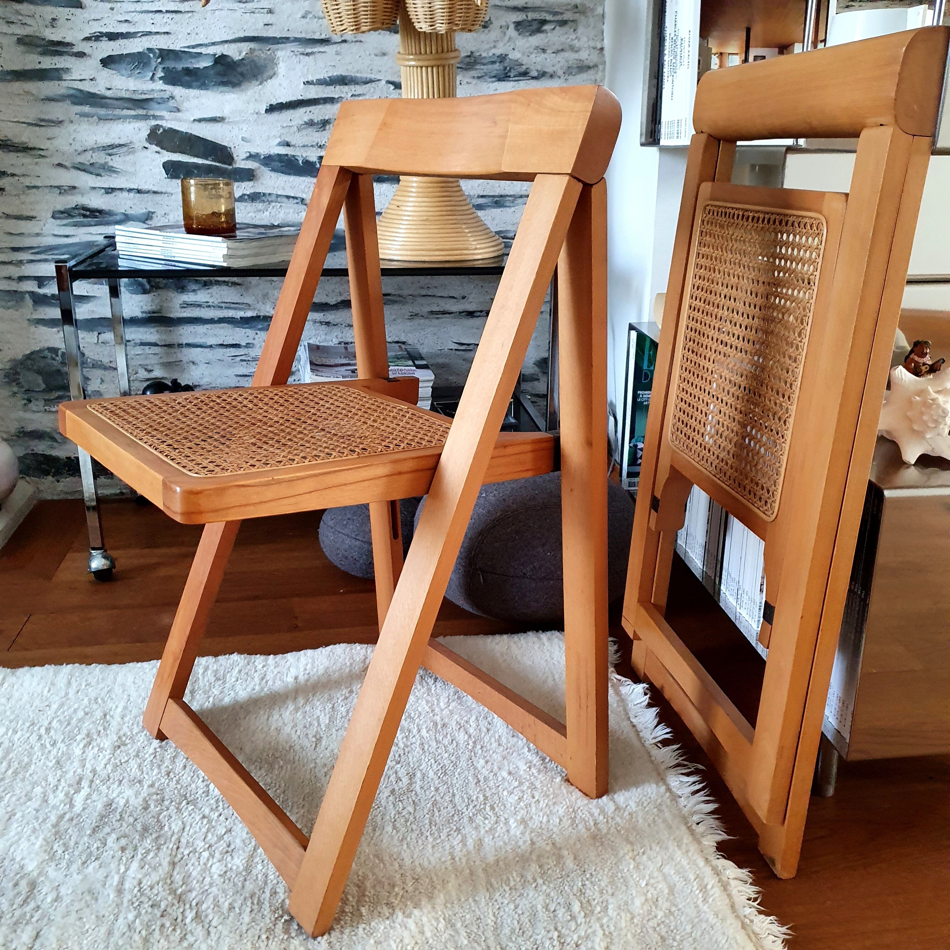Pair of canned folding chairs.