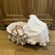 1960s wicker cradle with mattress and drapes.