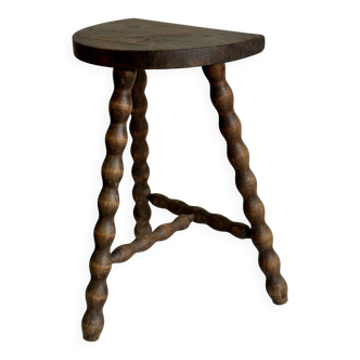 Antique tripod stool in twisted carved wood
