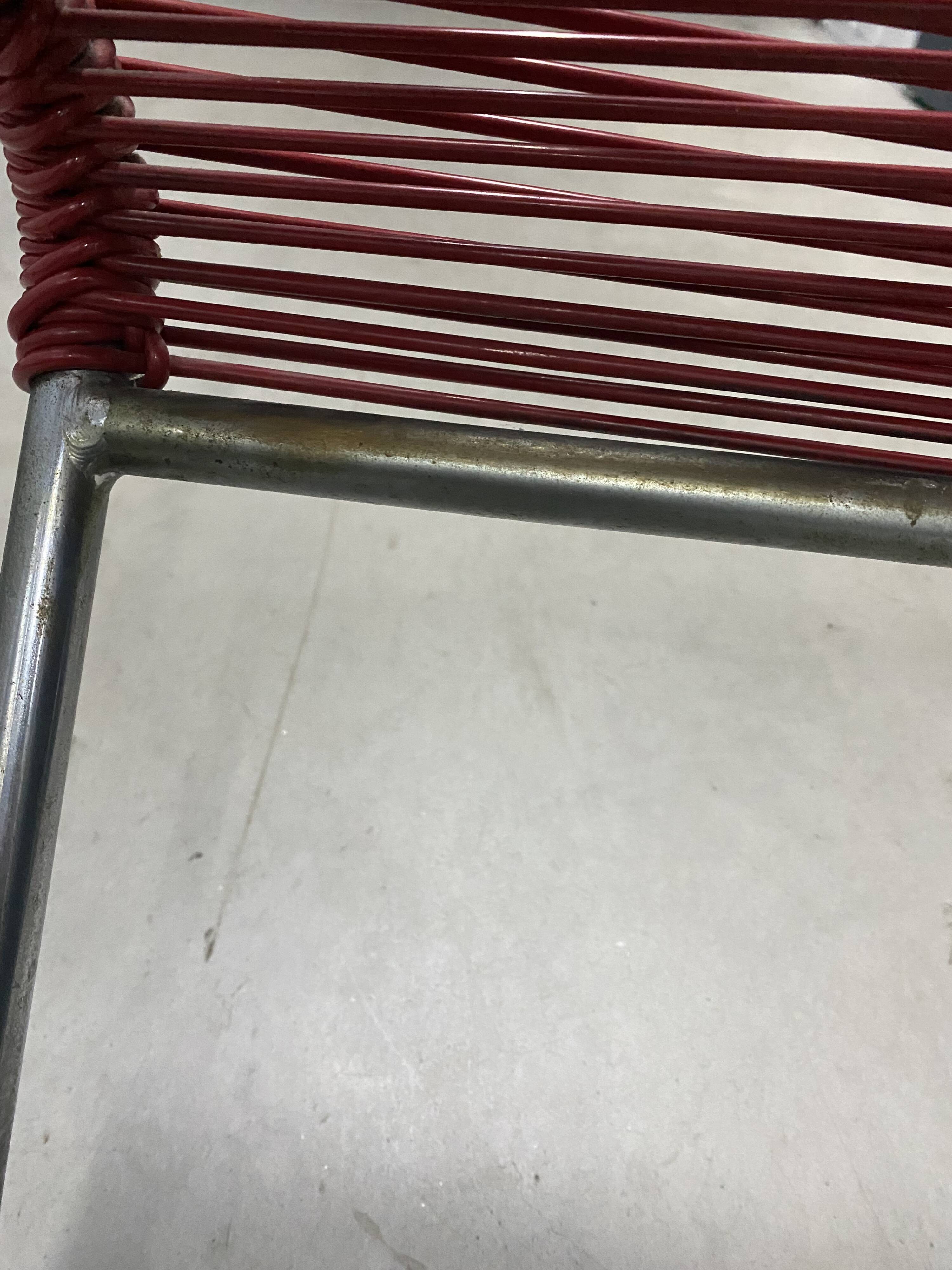 Red scoubidou chair from the 1960s.