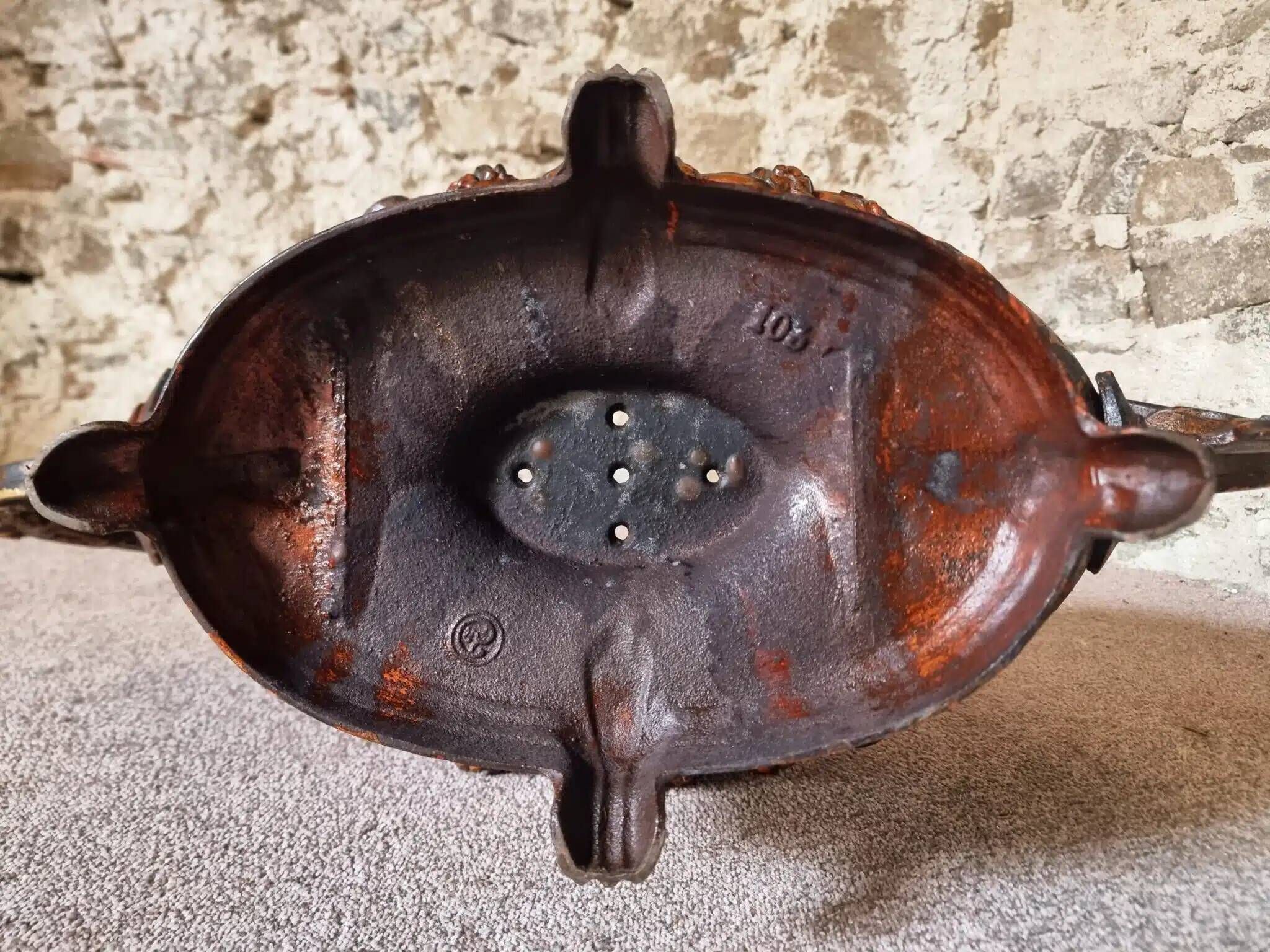 Large antique cast iron planter on a stand, brown-gold patina, France, circa 1900.