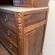Antique carved wooden dressing table with marble and tilting oval mirror.