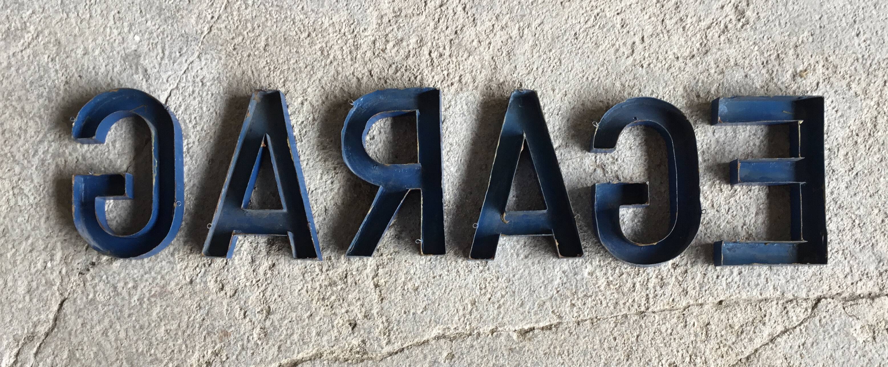 Metal sign letters forming the word GARAGE - vintage workshop