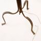 Wrought iron tripod floor lamp decorated with stylized animal heads