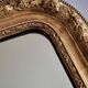Miroir Louis-Philippe en bois et stuc doré à décor floral, XIXe, 43 x 38 cm