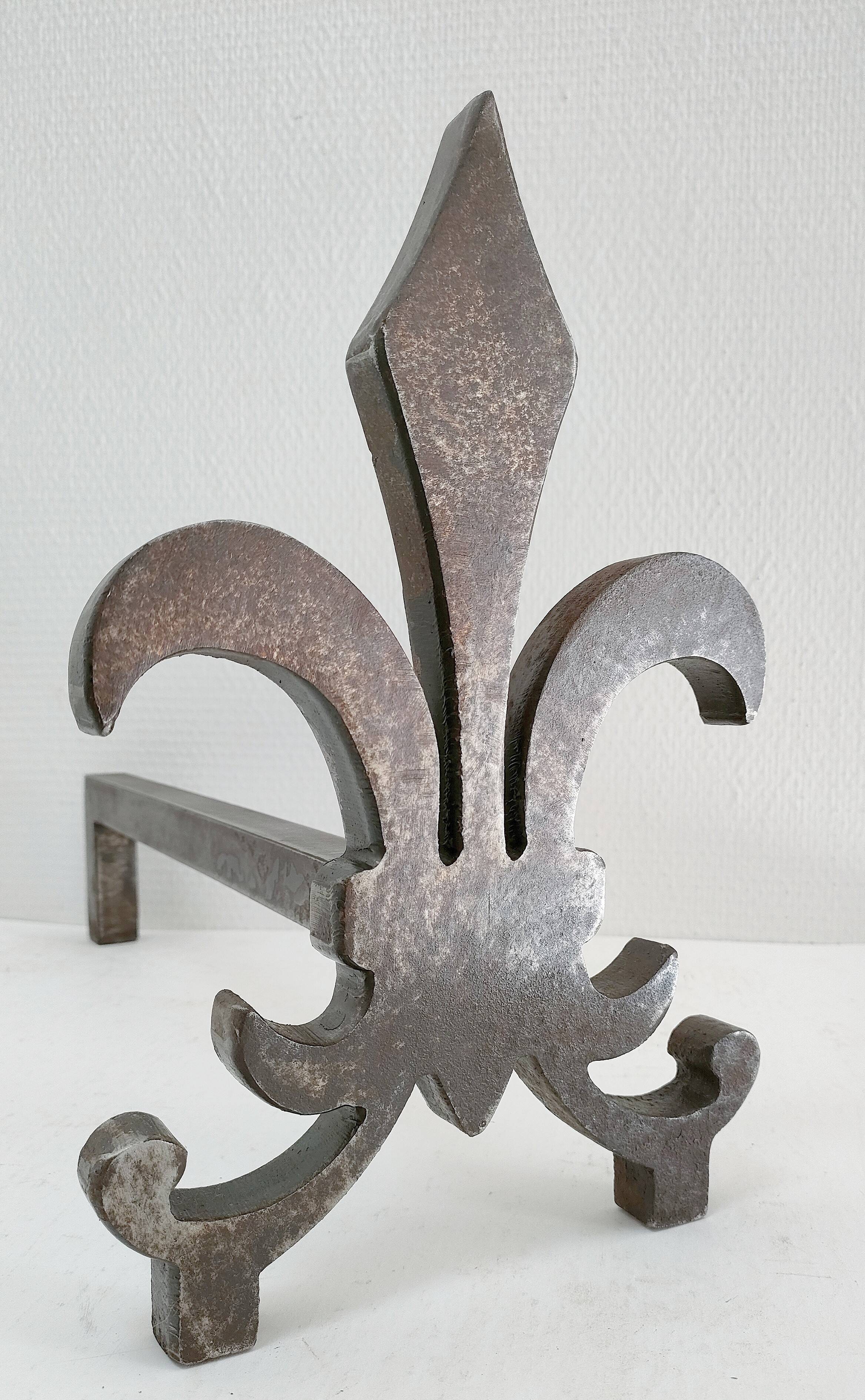 Pair of vintage steel fleur-de-lys andirons