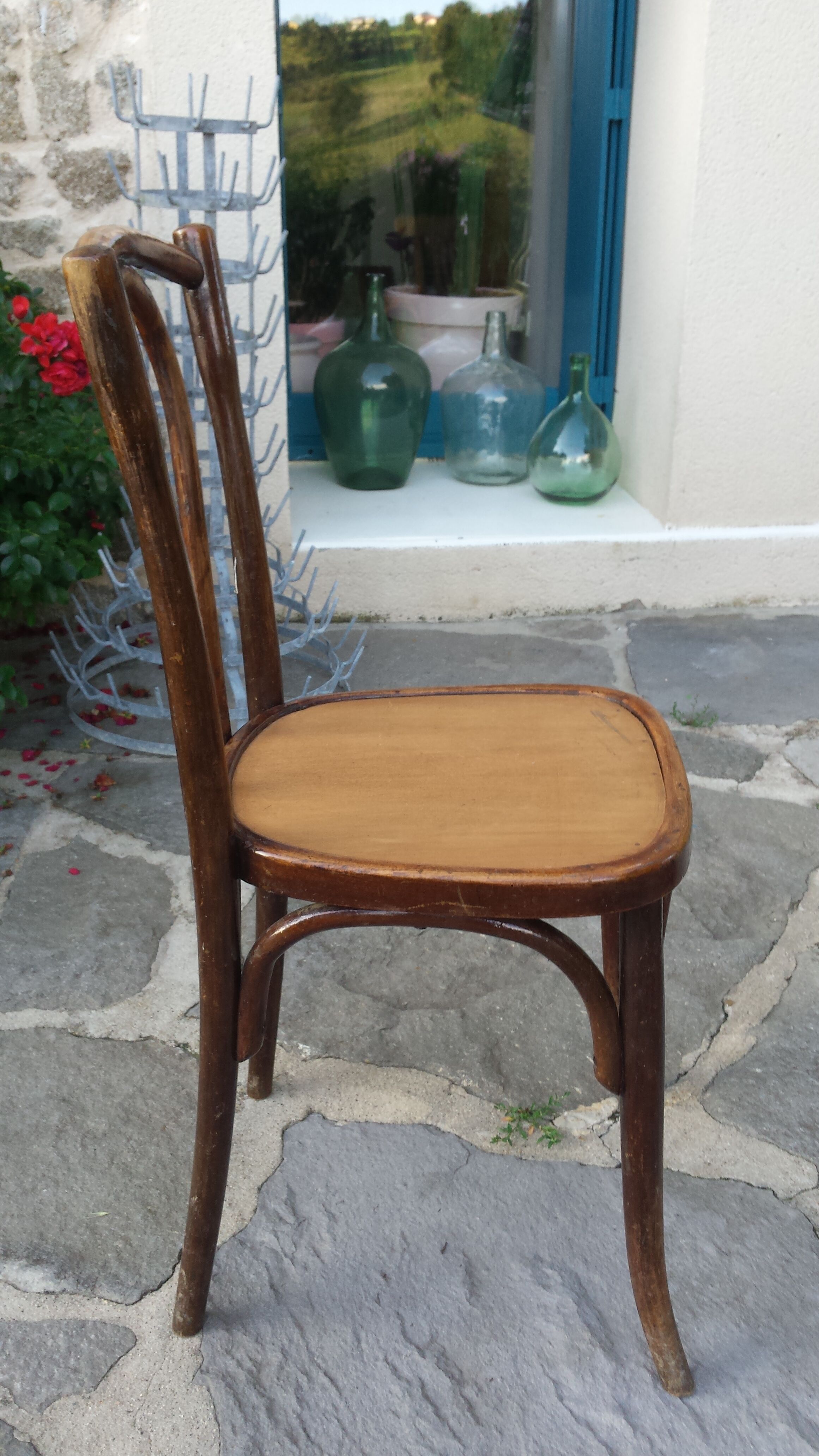 Bistro chair with buchon brand plate