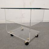 End of sofa with glass and plexiglass wheels from the 70s