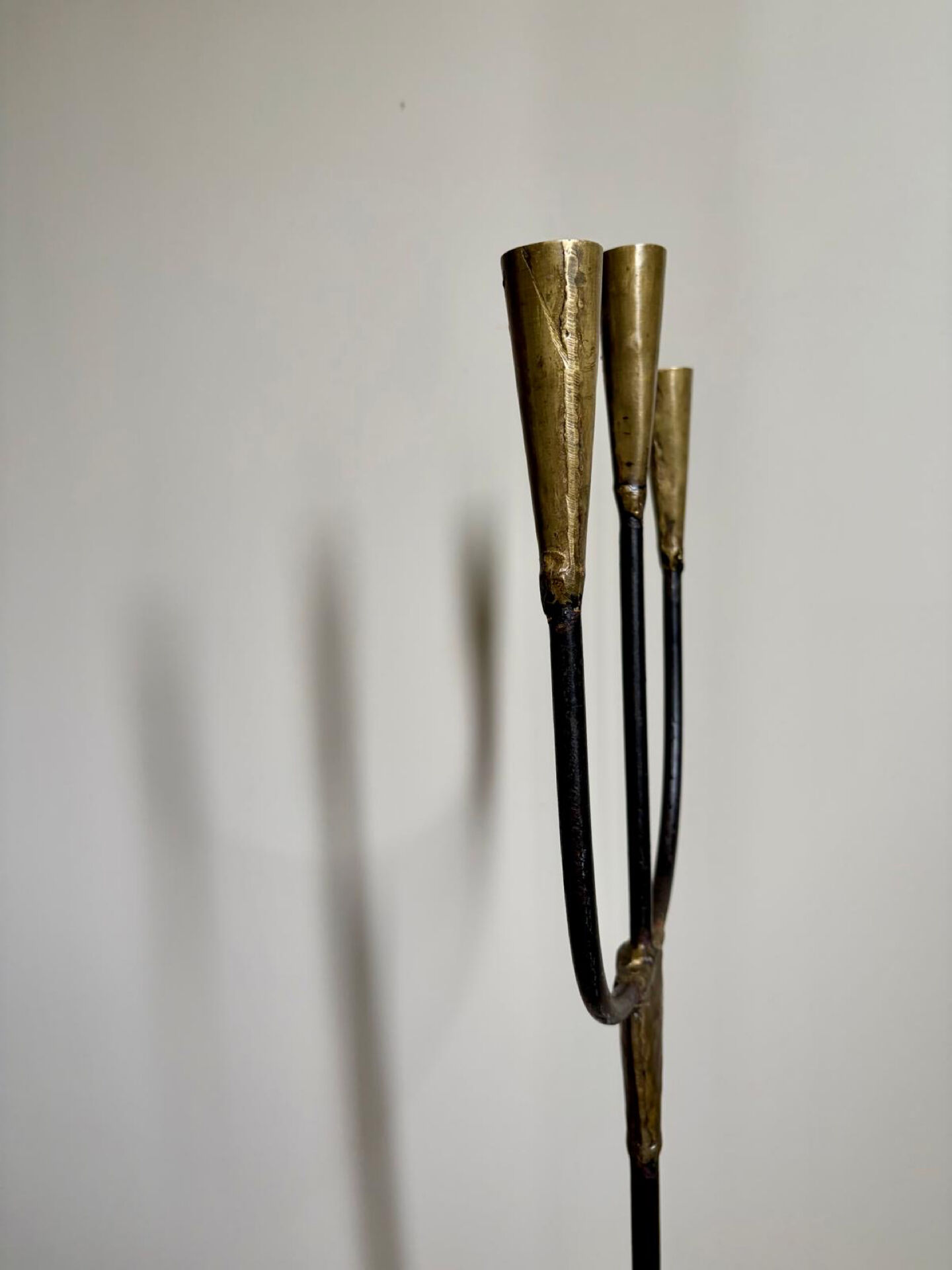 Candelabrum for the floor in wrought iron and brass.