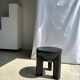 Black mango wood tripod side table with a semi-spherical top, height: 45 cm, diameter: 44 cm.