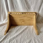Old small hanging shelf in solid wood