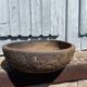 Old carved wooden bowl with African decoration.